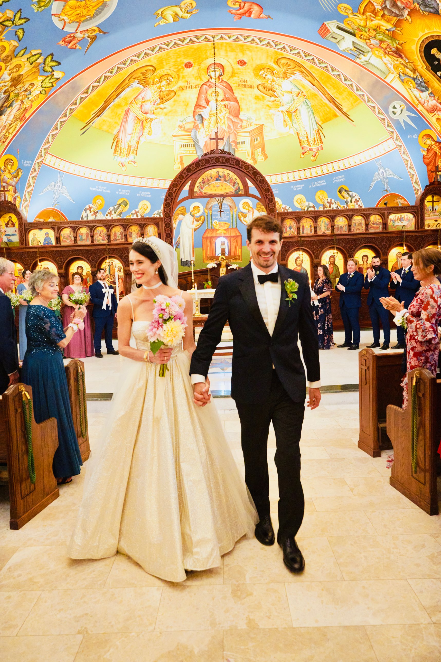 Gregory and Sherah walking down the aisle on their wedding day