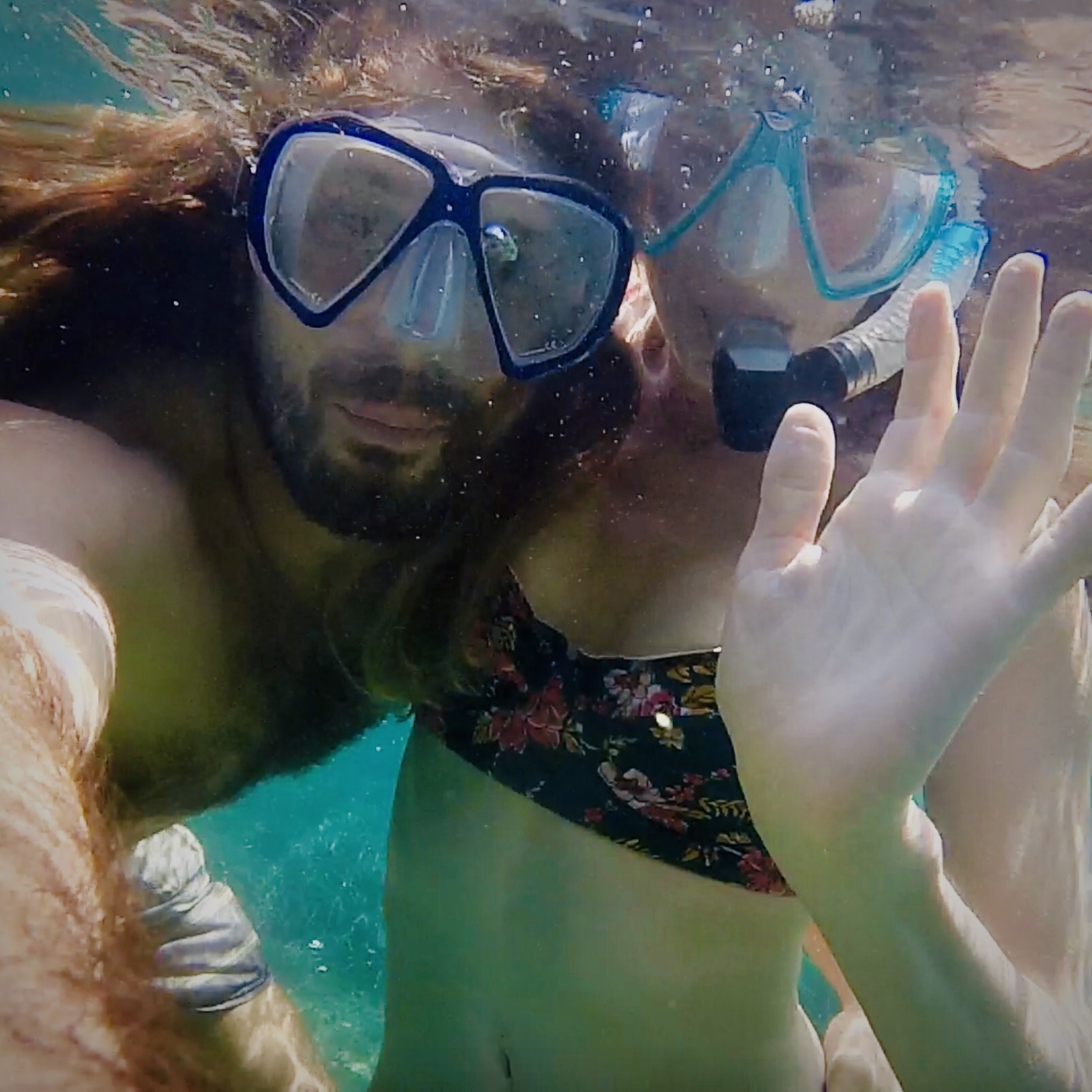 Gregory and Sherah snorkeling together underwater